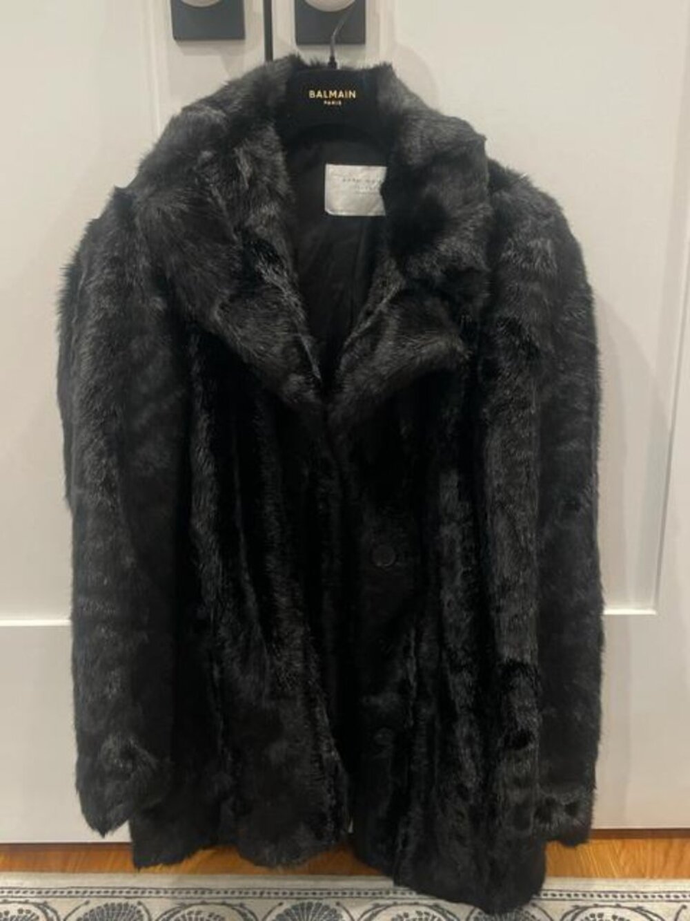 Black faux fur Zara coat. Has buttons and pockets.